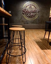 Empty chairs and tables on hardwood floor