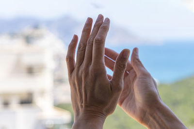 Close-up of hand against blurred background