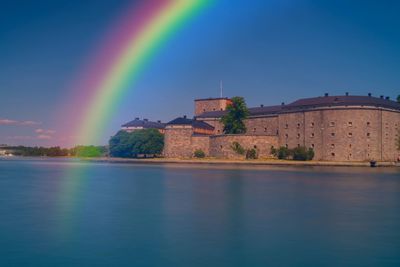 Scenic view of rainbow over lake against sky. waxholm fortress 