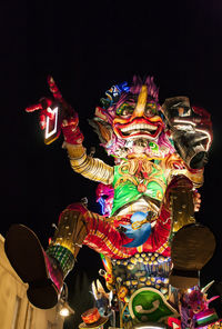 Low angle view of illuminated statue