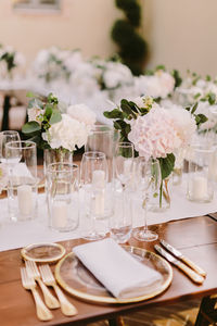 Close-up of flowers in glass on table