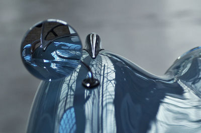 Close-up of blue hanging against wall