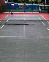 Man playing basketball court