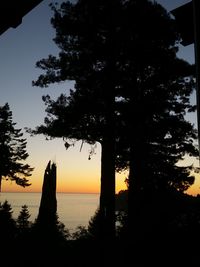 Scenic view of calm sea at sunset