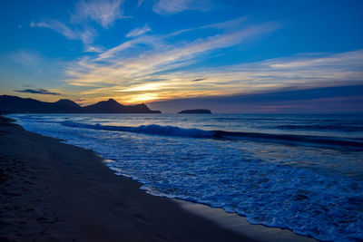 Sunrise over the headland east of vila baleira, porto santo island, madeira, portugal