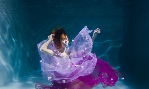 Woman swimming in pool