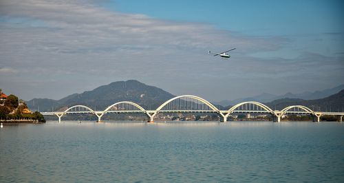 Bridge over river against sky