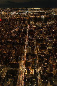 Aerial view of illuminated cityscape at night