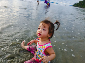 Portrait of cute girl in water