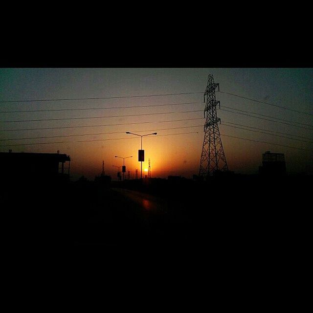 power line, electricity pylon, sunset, silhouette, electricity, power supply, connection, cable, fuel and power generation, power cable, sky, technology, clear sky, orange color, built structure, dark, nature, dusk, outdoors, copy space