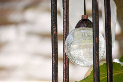 Close-up of light bulb against wall