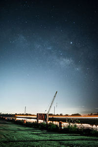 Scenic view of field against sky at night