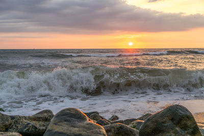 Scenic view of sea against sky during sunset