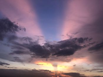 Low angle view of dramatic sky during sunset