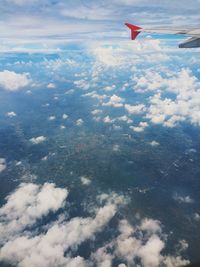 Aerial view of airplane flying over landscape