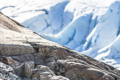 Close-up of rock on sunny day during winter