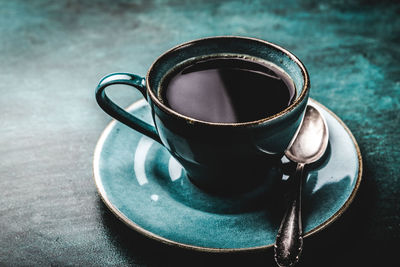 Close-up of coffee cup on table