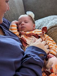 Portrait of boy sleeping on bed at home