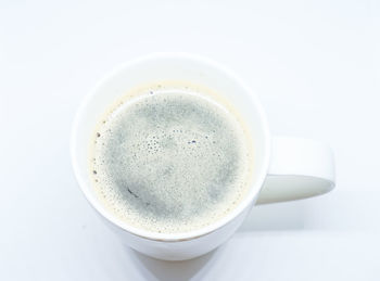 High angle view of coffee cup on table