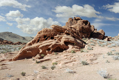 Rock formations in desert against sky