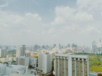 High angle view of buildings in city against sky