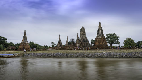 Panoramic view of temple by building against sky