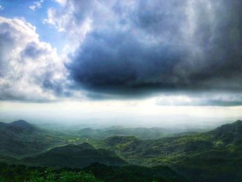 Scenic view of landscape against cloudy sky