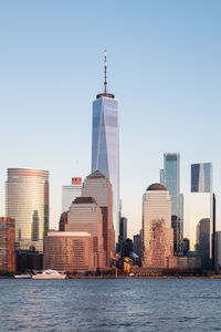 Modern buildings in city against clear sky