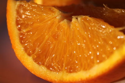 Close-up of orange slice on table