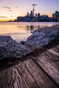 View of buildings in city at sunset