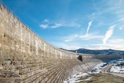View of dam on road against sky