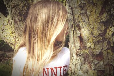 Rear view of young woman in forest