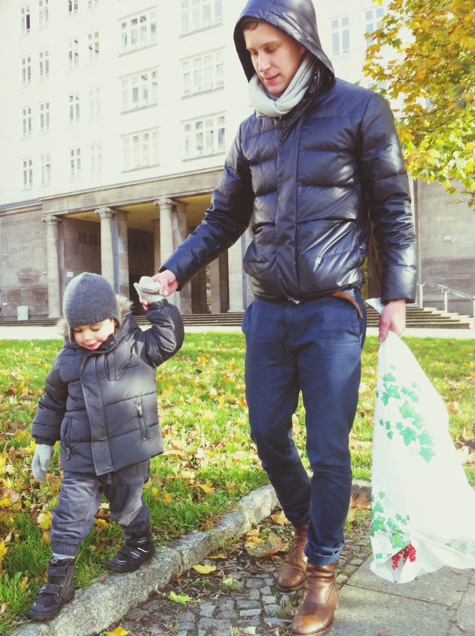 casual clothing, lifestyles, person, young adult, standing, building exterior, full length, leisure activity, front view, built structure, architecture, hands in pockets, portrait, young men, looking at camera, jacket, three quarter length