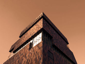 Low angle view of building against sky during sunset