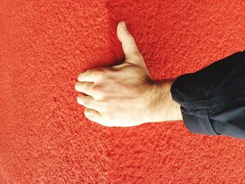 Rear view of woman relaxing on ground