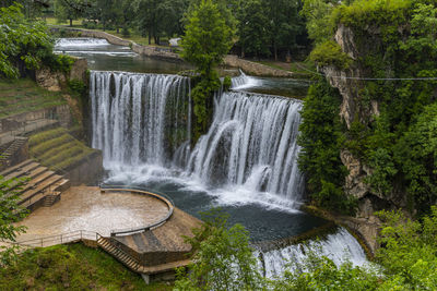 Scenic view of waterfall in forest