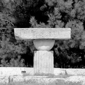 Sculpture against trees and plants