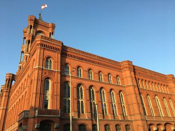 Low angle view of historical building against blue sky