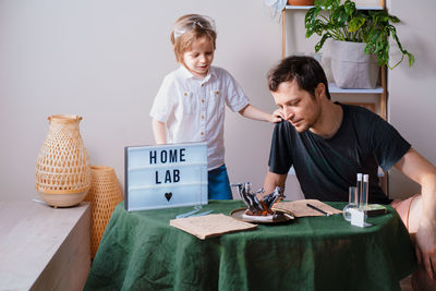 Boy sitting on table