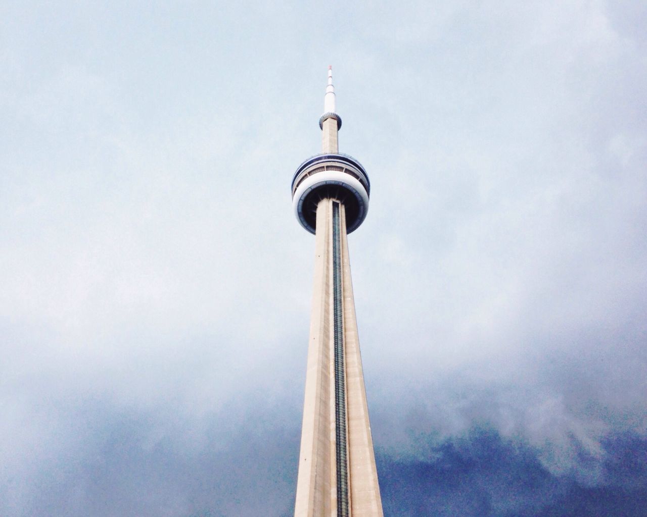 communications tower, tower, low angle view, tall - high, international landmark, communication, television tower, architecture, travel destinations, sky, built structure, culture, spire, tourism, famous place, fernsehturm, travel, capital cities, cloud - sky, sphere