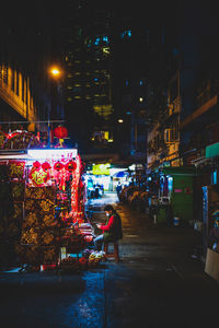 Illuminated street market at night