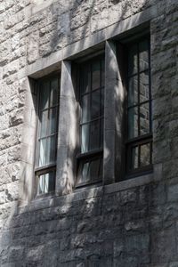 Low angle view of window on old building