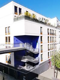 Low angle view of buildings against clear blue sky