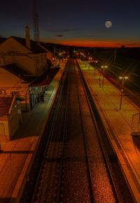 High angle view of railroad station against sky at night