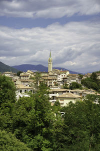 Buildings in city against sky