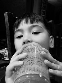 Close-up portrait of cute boy playing