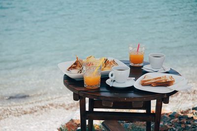 Place setting on table by sea