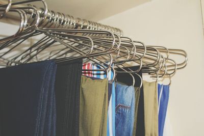 Close-up of clothes hanging on rack
