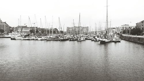 Boats moored at harbor