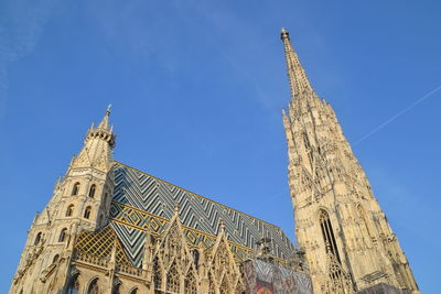 Low angle view of stephansdom, the cathedral of vienna, against blue sky